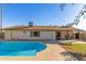 Inviting kidney-shaped pool in sunny backyard at 2664 W Ocaso Cir, Mesa, AZ 85202