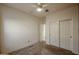 Bedroom with double door closet and ceiling fan at 2759 E Mews Rd, Gilbert, AZ 85298