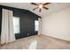 Bedroom featuring carpet, dark blue accent wall, and window coverings at 2759 E Mews Rd, Gilbert, AZ 85298