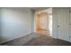 Bedroom featuring carpet, and access to hallway and closet at 2759 E Mews Rd, Gilbert, AZ 85298