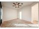 Bedroom with carpet, ceiling fan, and access to bathroom and closet at 2759 E Mews Rd, Gilbert, AZ 85298