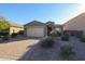 Single-story home with a two-car garage and landscaped front yard at 2759 E Mews Rd, Gilbert, AZ 85298