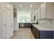 Modern kitchen with gray cabinets and white countertops at 2759 E Mews Rd, Gilbert, AZ 85298