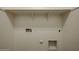 Laundry area with overhead shelving and hookups at 2759 E Mews Rd, Gilbert, AZ 85298