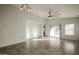 Bright living room with tile floors, ceiling fan, and sliding glass door at 2759 E Mews Rd, Gilbert, AZ 85298