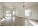 Spacious living room featuring tile floors and a view to the backyard at 2759 E Mews Rd, Gilbert, AZ 85298
