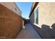 Side yard with concrete pathway and block wall at 2759 E Mews Rd, Gilbert, AZ 85298