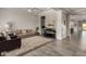 Living room with gray tile floors, white shiplap wall, and comfy seating at 4288 E Comstock Dr, Gilbert, AZ 85296