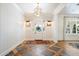 Bright entryway with hardwood floors, white walls, and a geometric tile floor at 455 N 39Th Way, Mesa, AZ 85205