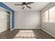 Bedroom with spacious closet and wood-look flooring at 4901 S Calle Los Cerros Dr # 241, Tempe, AZ 85282