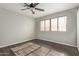 Bright bedroom with ceiling fan and wood-look flooring at 4901 S Calle Los Cerros Dr # 241, Tempe, AZ 85282