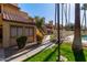 Condo building exterior with pool and walkway access at 4901 S Calle Los Cerros Dr # 241, Tempe, AZ 85282