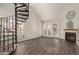 Living room with spiral staircase and wood floors at 4901 S Calle Los Cerros Dr # 241, Tempe, AZ 85282