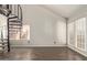 Living room with spiral staircase and large windows at 4901 S Calle Los Cerros Dr # 241, Tempe, AZ 85282