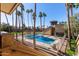 Community pool area with surrounding palm trees at 4901 S Calle Los Cerros Dr # 241, Tempe, AZ 85282
