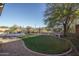 Landscaped backyard with artificial turf and sitting bench at 5037 E Sleepy Ranch Rd, Cave Creek, AZ 85331