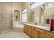 Bathroom with double sinks, soaking tub, and shower at 5037 E Sleepy Ranch Rd, Cave Creek, AZ 85331