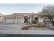 Single-story home with a two-car garage and desert landscaping at 5037 E Sleepy Ranch Rd, Cave Creek, AZ 85331