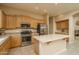 Modern kitchen featuring stainless steel appliances and an island at 5037 E Sleepy Ranch Rd, Cave Creek, AZ 85331