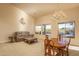 Bright and airy living room with a dining area and access to backyard at 5037 E Sleepy Ranch Rd, Cave Creek, AZ 85331
