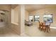 Spacious living and dining area with large windows and a chandelier at 5037 E Sleepy Ranch Rd, Cave Creek, AZ 85331