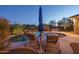 Relaxing pool area with lounge chairs and waterfall feature at 5037 E Sleepy Ranch Rd, Cave Creek, AZ 85331