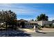 Charming single story home with desert landscaping and a welcoming front entryway at 5345 E Mercer Ln, Scottsdale, AZ 85254