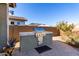 Built-in outdoor grill with side burner and patio at 5640 W Victory Way, Florence, AZ 85132