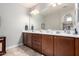 Double vanity bathroom with modern wood cabinets at 5640 W Victory Way, Florence, AZ 85132