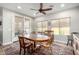Bright dining room featuring a wooden table and chairs, access to backyard patio at 5640 W Victory Way, Florence, AZ 85132
