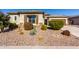 House exterior showcasing desert landscaping and a two-car garage at 5640 W Victory Way, Florence, AZ 85132