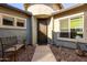 Front entry with decorative wrought iron gate and stone pathway at 5640 W Victory Way, Florence, AZ 85132