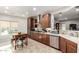 Spacious kitchen boasts modern cabinetry, stainless steel appliances, and tile flooring at 5640 W Victory Way, Florence, AZ 85132