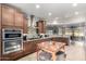 Well-equipped kitchen with double oven, custom cabinetry, and a large island at 5640 W Victory Way, Florence, AZ 85132