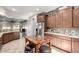 Modern kitchen with ample counter space, wooden breakfast bar, and stainless steel appliances at 5640 W Victory Way, Florence, AZ 85132
