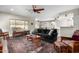 Spacious living room with hardwood floors, ceiling fan, and comfy seating at 5640 W Victory Way, Florence, AZ 85132