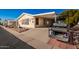 Mobile home with carport and golf cart,landscaped yard at 6209 E Mckellips Rd # 446, Mesa, AZ 85215