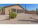 Landscaped backyard with gravel, cacti, and a bird bath at 6416 E Hacienda La Noria Ln, Gold Canyon, AZ 85118