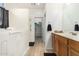 Bathroom with walk-in shower, double vanity, and linen closet at 6416 E Hacienda La Noria Ln, Gold Canyon, AZ 85118