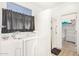 Walk-in bathtub and shower, with linen closet at 6416 E Hacienda La Noria Ln, Gold Canyon, AZ 85118