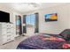 Bedroom with a queen bed, dresser, and private door to patio at 6416 E Hacienda La Noria Ln, Gold Canyon, AZ 85118