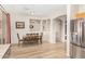 Bright dining area with table and chairs, hardwood floors, and access to kitchen at 6416 E Hacienda La Noria Ln, Gold Canyon, AZ 85118