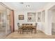 Bright dining area with table and chairs, hardwood floors, and access to backyard at 6416 E Hacienda La Noria Ln, Gold Canyon, AZ 85118