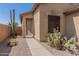Tan house with walkway and desert landscaping at 6416 E Hacienda La Noria Ln, Gold Canyon, AZ 85118