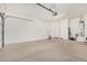 Spacious garage with ample storage space and an interior door at 6416 E Hacienda La Noria Ln, Gold Canyon, AZ 85118