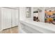Hallway with built-in shelving and kitchen view at 6416 E Hacienda La Noria Ln, Gold Canyon, AZ 85118