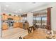 Kitchen with light wood cabinets, stainless steel appliances, and a breakfast bar at 6416 E Hacienda La Noria Ln, Gold Canyon, AZ 85118