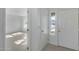 Bright and airy entryway with tile floors and open view to the living room at 6934 W Mclellan Rd, Glendale, AZ 85303