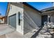 Newly painted home with gray front door and garage at 6934 W Mclellan Rd, Glendale, AZ 85303