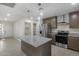 Modern kitchen with island and stainless steel appliances at 6934 W Mclellan Rd, Glendale, AZ 85303